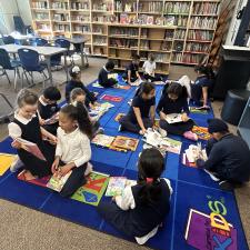 Buddy reading during library time.