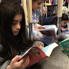 BookQuake - Students reading under their desks.