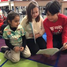 Grade 4s reading stories to little buddies.